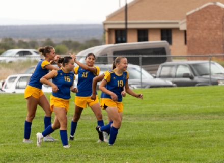 The San Juan girls soccer team celebrates a recent goal. Pictured (left to right) are Ari Adams, Ellie Beck, Brooklyn Lameman, and Brooklyn Pincock. The Lady Broncos are looking to get back in the win column after suffering losses in their last three games.  Brooke Pehrson photo