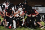 A host of Buckaroos gang tackle a Tiger in a showdown between Milford and Monticell. Anna Fredericks photo