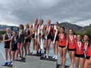 Members of the Monticello 4x400 relay team stand atop the podium after defeating Rich and Valley to win the state title. Buckaroos pictured (left to right): Latalia O’Harra, Lariah O’Harra, Josie Mack, and Alex Marian.  Courtesy photo