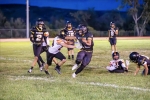 Whitehorse running back Hunter Tsinigine stiffarms Monticello’s Miles Coleman to gain some of his nearly 200 yards against the Buckaroos on September 21 in Montezuma Creek. Also in on the play are Dillion Leo (#2), Eliyeontay Silas (#55), Tyrell Black (#8), and Canyon Christensen (#11).  Katelyn Yellowman photo