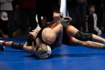 Monticello's John Leber pins his opponent in the divisional finals. Anna Fredericks photo