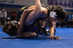 Monument Valley's Jace Tsosie earns near fall points in the divisional final. Anna Fredericks photo