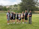 The Monticello High School girls golf team proudly poses with their 2026 1A Utah State Championship trophy at the Rose Park Golf Course in Salt Lake City. The Buckaroos won their second straight state title and third in the last four years on May 13. Sophomore LE Olson missed winning the individual championship by just one stroke. Pictured: (left to right) Head Coach Nathan Chamberlain, Rebecca Chamberlain, Alice Butler, Cailyn Harrod, LE Olson, Jane Burton, Coach Shane Brewer, and Coach Michael Holyoak. Co