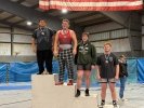 San Juan's Porter Keith stands on top of the podium. The senior finished first at the Panguitch Invitational